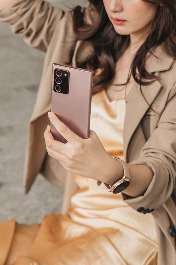 Woman filming herself with a smartphone